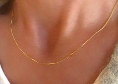 "14K Gold Filled Box Chain Necklace This dainty chain is an instant classic with rich lustrous colour of 14K gold filled. Italian-made of excellent quality. Wear on its own as the perfect finishing touch - it also looks fantastic layered with other necklaces. Available lengths: 16\" 18\" 20\" - .8mm wide - all components are 14k gold filled - finished with a strong spring ring clasp Some photos are magnified closeups to show chain details. Please measure and select chain length carefully using s Hypoallergenic Gold Sterling Silver Chain Necklace, Delicate 14k Gold Box Chain Jewelry, Dainty Box Chain Necklace, Delicate Gold Jewelry With Box Chain, Elegant Gold Hypoallergenic Chain Necklace, Elegant Hypoallergenic Snake Chain Necklace, Dainty Yellow Gold Box Chain Jewelry, Box Chain Necklace, Necklace For Her