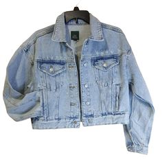 Wild Fable Acid Wash Cropped Denim Trucker Jacket Size Xs. Features 2 Welt Pockets And 2 Flap Pockets With Button Closure. Soft, Flexible Cotton Construction. Distressed Look. Size: Women's Xs Measurements: Chest (Pit To Pit) 19" Length 18" Sleeve 19" Condition: New Without Tags. New, Unworn Item With No Original Tags Fast, Reliable Shipping. We Want You To Receive Your Purchase As Quickly And Hassle-Free As Possible. Spring Light Wash Denim Jacket With Pockets, Light Wash Denim Jacket With Pockets For Spring, Trendy Washed Blue Denim Jacket For Spring, Winter Cropped Denim Jacket In Medium Wash, Winter Cropped Medium Wash Denim Jacket, Casual Cropped Dark Wash Denim Jacket, Cropped Medium Wash Denim Jacket For Winter, Trendy Light Wash Denim Jacket With Pockets, Fall Light Wash Denim Jacket