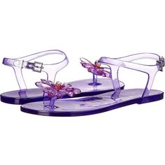 a pair of purple sandals with flowers on them