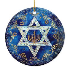 a blue ornament with a star of david in the center and three candles on it