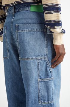 The Milanese label blends carpenter and cargo aesthetics in retro indigo-washed jeans boasting the baggy silhouette seen all over the 2024 runways. 31" inseam; 9" leg opening; 13" front rise; 15" back rise (size 48eu) Zip fly with button closure Front slant pockets; back patch pockets; cargo patch pockets 100% cotton Dry clean Made in Italy Designer Clothing Wide Leg Recycled Denim Cargo Jeans With Patch Pockets, Utility Cargo Jeans With Patch Pockets In Washed Blue, Blue Utility Cargo Jeans In Rigid Denim, Utility Blue Cargo Jeans In Rigid Denim, Utility Washed Blue Cargo Jeans In Rigid Denim, Medium Wash Recycled Denim Cargo Jeans, Recycled Denim Cargo Jeans With Side Pockets, Baggy Utility Cargo Jeans In Rigid Denim, Blue Recycled Denim Cargo Jeans With Patch Pockets