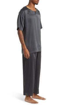 A henley-style top pairs with matching bottoms in breathable silk pajamas that feel like a dream and can be cleaned in the washing machine. Top has crewneck; short sleeves Bottoms have elastic waist; front slant pockets 100% silk Machine wash, dry flat Imported Silk V-neck Tops For Loungewear, Relaxed Fit Casual Pant Set For Daywear, Casual Relaxed Fit Pant Set For Daywear, Casual Sets For Summer Nights, Casual Summer Night Sets, Silk Sleepwear For Loungewear In Relaxed Fit, Silk Sleepwear Relaxed Fit For Loungewear, Relaxed Fit Short Sleeve Pant Set For Loungewear, Casual Viscose Sleepwear In Relaxed Fit