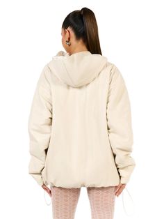 Thoughtfully crafted from soft vegan leather, our statement hoodie is lined and designed with a touch of fill for insulating warmth. Kangaroo pockets, bungee cord and toggle for your style preference completes the vibe. Vegan Leather Collection Imported Self: 60% PU, 35% Polyester, 5% Spandex Lining: 95% Polyester, 5% Spandex Model is wearing size X-Small This item is lined True to size Spring Outerwear With Kangaroo Pocket In Solid Color, Spring Solid Outerwear With Kangaroo Pocket, Spring Solid Color Outerwear With Kangaroo Pocket, Beige Hooded Puffer Jacket With Double-lined Hood, Cream Hooded Outerwear With Double-lined Hood, Cream Windbreaker For Winter Streetwear, Trendy Hooded Outerwear With Kangaroo Pocket, Nylon Hoodie With Drawstring Hood, Cream Hooded Jacket With Drawstring