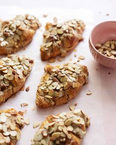 several pieces of bread with almonds on top