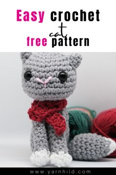 a crochet cat sitting next to balls of yarn with the text easy crochet free pattern