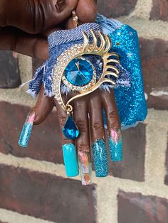 Super cute mani keychain with denim cuff, blinged out tear drop eye and matching blue coin purse and reflective glitter nails Baddie Keychain, Tear Drops Eye, Reflective Glitter Nails, Blue Bling Nails, Denim Nails, Mini Hands, Keychain Gift, Tear Drop, Glitter Nails