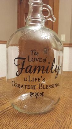 a glass bottle with the words, love of family is life's greatest blessing