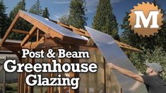 a man standing next to a house with the words post and beam greenhouse glazing