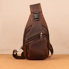 Crazy Horse Leather Chest Bag for Men's Leisure Retro Style Crossbody Bag Top Layer Cowhide Shoulder Bag Commuter Outdoor Leisure Bag PRODUCT INFORMATION --------------------------------------------- --Product Size: 34x9x17 cm--13.38x6.69x3.54 inch; --Item Weight:0.6 kg/1.32lb --Color: Deep Brown --High-Quality Stitching This bag has an adjustable shoulder strap. On the back of the crossbody bag are two hooks for both the left and right shoulders The ultimate grab-and-go daypack, this brown leather crossbody bag is built to be an upgrade on overstuffed pockets. It's made from genuine full grain buffalo leather, the highest grade available. That means the very top layer of the hide only is used. Buffalo leather is the strongest and thickest type available. This gives it the longest durabili Brown Travel Chest Bag, Brown Chest Bag For Travel, Portable Brown Chest Bag For Travel, Leather Crossbody Chest Bag For Outdoor Activities, Brown Crossbody Chest Bag For Outdoor, Brown Satchel Chest Bag For Outdoor, Leather Chest Bag With Adjustable Strap For Outdoor, Brown Chest Bag With Zipper For Outdoor, Brown Chest Bag With Zipper Pocket For Outdoor