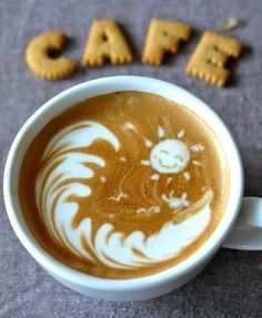 a cappuccino with the word cafe written in it