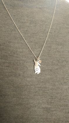 "Cute little flip flop Lop bunny pendant necklace. The Lop rabbit charm necklace is hand made with love from solid .925 Anti Tarnish sterling silver. You can add It has a tiny heart dangle on the chain plain or add an initial. Pendant Size ~ 7/8\" (21mm) W x 5/8\" (15mm) H Necklace Length ~ available in 16\", 18\", 20\" & 24\" Material ~ All Sterling silver, 925 Mixed breed? want YOUR pet? check out my custom silhouette TaGette necklaces https://www.etsy.com/shop/DiBAdog?section_id=15431427 Cute Sterling Silver Pendant Charm Necklaces, Cute Sterling Silver Pendant Charm Necklace, Handmade Cute Sterling Silver Charm Necklaces, Cute Hypoallergenic Sterling Silver Necklaces, Cute Hypoallergenic Sterling Silver Necklace, Silver Bunny Design Jewelry For Gifts, Silver Bunny Design Jewelry Gift, Cute Sterling Silver Charm Necklaces For Mother's Day, Cute Sterling Silver Charm Necklace For Mother's Day