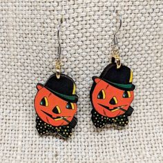 Vintage Window Decoration Dapper Pumpkin Earrings- Approx 1.5 inch - Stainless Steel Ear Hooks- Laser Cut Wood- Hypoallergenic- Matte GlazeHadmade to order. Up to two week processing time. Wholesale orders welcome 😀 Vintage Handmade Halloween Earrings, Handmade Vintage Halloween Earrings, Fun Halloween Earrings For Gifts, Fun Halloween Earrings Gift, Fun Halloween Gift Earrings, Vintage Halloween Earrings As Gift, Halloween Themed Earrings As Gift, Halloween Themed Earrings For Gifts, Vintage Earrings For Halloween Gift