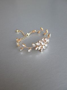 "This delicate floral bracelet is made with beautiful sparkly Swarovski crystals. The bracelet measures 3/4\" wide in the center and it will fit 6\" to 8\" wrist. Available in gold, silver or rose gold finish. - For the matching earrings please take a look here: https://www.etsy.com/listing/203769737/bridal-crystal-earrings-sparkly-crystal?ref=shop_home_active_82 - For the matching headpieces please take a look here: https://www.etsy.com/listing/491338441/swarovski-crystal-bridal-hair-vine?ref=s Floral Engagement Ring, Crystal Bridal Earrings, Crystal Belt, Bracelet Wedding, Swarovski Crystal Bracelet, Swarovski Bracelet, Floral Bracelet, Sparkly Earrings, Wedding Jewelry Bracelets