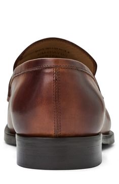 A lightly cushioned footbed brings impeccable comfort to a smooth loafer crafted from smooth Italian leather. Leather upper and lining/rubber sole Made in Italy Leather Loafers With Smooth Grain And Plain Toe, Timeless Brown Cap Toe Loafers, Classic Brown Plain Toe Slip-ons, Classic Cognac Dress Shoes With Rubber Sole, Classic Slip-on Tassel Loafers With Leather Footbed, Classic Monk Strap Shoes In Cognac With Round Toe, Classic Monk Strap Shoes With Round Toe In Cognac, Classic Cognac Slip-on Moccasins, Classic Cognac Monk Strap Shoes With Round Toe