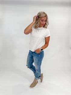 Get ready to elevate your everyday style with our Asher Crew Neck Striped Tee in Ivory Rose Stripe. With a relaxed fit and classic stripe design, this tee will quickly become a go-to in your wardrobe. Perfect for those days when you want to look effortlessly chic while staying comfortable. Length: 23.5" Sleeve Length 6.5" Crew Neckline Stunning Silhouette Relaxed Fit Colors May Vary From Different Viewing Devices Runs True to Size Amy is 5'4", 34B Wearing a Size Small Material and Care 100% Cott Chic Striped Cotton T-shirt, Casual Tops With Striped Hem For Everyday, White Relaxed Fit Top With Striped Hem, Striped Cotton T-shirt For Day Out, Relaxed Fit T-shirt With Striped Hem For Spring, Chic Striped T-shirt For Spring, Trendy Spring T-shirt With Vertical Stripes, White Vertical Stripes T-shirt For Spring, White T-shirt With Vertical Stripes For Spring