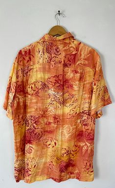 "-Description- >men's orange & red floral leaf print hawaiian shirt >collared >button front >open pocket on the front >size medium/large - marked a medium on tag but chest measurement is more like a large - please check measurements before purchase >so bold! >condition: great >color(s): orange, red >fabric(s): 100 rayon >brand: caribbean joe >care: machine wash -Measurements- >size: medium/large - marked a medium on tag but chest measurement is more like a Orange Relaxed Fit Hawaiian Shirt With Short Sleeves, Orange Short Sleeve Hawaiian Shirt, Orange Hawaiian Short-sleeve Top, Orange Floral Print Shirt For Vacation, Tropical Orange Short Sleeve Top, Orange Collared Shirt With Floral Print, Orange Floral Print Collared Shirt, Palm Tree Island, Wild Print