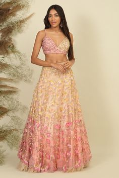 Baby pink woven lehenga with sequins, beads, pearls and crystals embroidery. Comes with a blouse and a dupatta.
Components: 3
Pattern: Woven, Embroidered
Type Of Work: Sequins, Beads, Pearls, Crystals
Neckline: V Neck
Sleeve Type: Sleeveless
Fabric: Net, Silk, Lining : Shantoon
Color: Pink
Other Details: 
Attached lining
Closure : Zip and hooks
Occasion: Bride,Wedding - Aza Fashions Festive Party Wear Choli With Floral Embroidery, Festive Floral Embroidered Party Wear Choli, Festive Floral Embroidered Party Choli, Diwali Party Lehenga With Floral Embroidery, Summer Anarkali Lehenga With Resham Embroidery, Traditional Summer Lehenga For Reception, Traditional Summer Reception Lehenga, Summer Reception Embellished Lehenga, Summer Lehenga With Zari Work