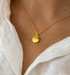 The sweet miniature locket medallion necklace is a great addition to your collection and also makes a memorable gift for someone. This charming piece is handcrafted with care to ensure that every detail is unique.  -Made with high-quality brass dipped in 14k gold, it is delicate and dainty, but makes a statement alone or layered with other necklaces.  -The locket is designed to hold your most cherished memories close to your heart, making it a perfect gift for someone special in your life.  -The locket medallion necklace is 16" with a 2-inch extension chain. -All our jewelry comes beautifully and safely packed in a gift box. You can include a gift message. Receipt is not included in the package. Gold Locket, Locket Charms, Medallion Necklace, Gift Message, Gold Plated Necklace, Cherished Memories, Necklace Gift, Locket, Charm Necklace