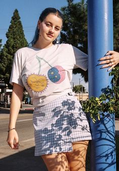 These sun and moon cherries are ripe and ready to be plucked from the heavens. Hand drawn design with vibrant colors and celestial sweetness. Printed on a unisex tee in White Fleck Triblend. 50% Polyester, 25% Cotton, 25% Rayon. Model wears size Medium. Aesthetic Graphic Print Tops For Summer, Aesthetic Short Sleeve T-shirt With Screen Print, Trendy Cotton T-shirt With Moon Print, Casual Cotton T-shirt With Moon Print, Relaxed Fit Short Sleeve T-shirt With Moon Print, Relaxed Fit T-shirt With Fruit Print For Spring, Aesthetic Graphic Print T-shirt For Summer, Aesthetic Graphic Print Tops For Spring, Cotton Graphic Tee With Moon Print