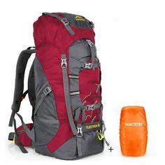 the backpack is next to an orange sleeping bag