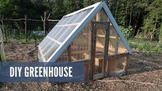 a small greenhouse with the words diy greenhouse on it