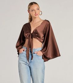 This silky satin crop top features trendy kimono half-length sleeves and a tie-front design making it perfect for layering or styling on its own. Fit & FeaturesSatin woven fabric, no stretchKimono half-length sleevesTie-front designCropped length hemRuns true to size Trendy Satin Crop Top, Chic Satin Wrap Blouse, Trendy Satin Blouse For Spring, Chic Cropped Satin Blouse, Spring Cropped Satin Blouse, Orange Homecoming Dresses, Backless Dress Short, Purple Homecoming Dress, Green Homecoming Dresses