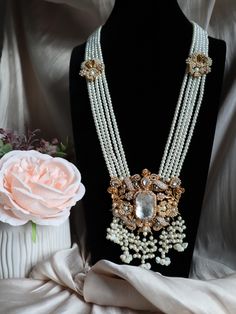 ✨ Stunning Eastern Elegance ✨ Indulge in luxury with our handcrafted statement necklace and earrings set, adorned with lustrous pearls and intricate gold detailing. Perfect for those special occasions where you want to stand out with timeless beauty and grace. ✨ 💎 This set features: Multi-strand pearl necklace Dazzling crystal centerpieces Intricate gold floral accents Matching opulent earrings Limited stock available!  . . . . Email : Houseofjavahir@gmail.com 🛒 Visit us at https://houseofjavahir.etsy.com 📩 DM for inquiries and orders! Opulent Bridal Necklace With Intricate Design For Festive Occasion, Opulent White Jewelry For Wedding, Opulent Bridal Necklace For Festive Wedding, Elegant Kundan Bridal Necklace With Pearl Chain, Heavy Temple Jewelry Pearl Bridal Necklace, Heavy Temple Jewelry Bridal Pearl Necklace, Intricate Pearl Necklace For Celebrations, Festive Pearl Chain Necklace For Reception, Festive Bridal Necklace With Intricate Pearl Design