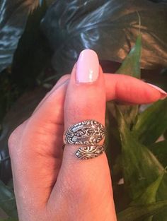 A gorgeous highly-crafted sterling silver vintage Victorian spoon ring with a rose flower in the middle. This ring is cast in incredible detail and makes for a beautiful ornate statement ring.  This ring has a very substantial weight to it.   The perfect ring for a night out on the town or just your favorite go-to everyday accessory.  Looks great with any outfit and on any finger, whether you choose to wear it on your thumb, index, midi or ring finger.  This ring is sure to be a conversation sta Vintage Sterling Silver Snake Ring Gift, Vintage Sterling Silver Snake Ring As A Gift, Vintage Engraved Toe Ring, Handmade Vintage Silver Snake Ring, Vintage Silver Toe Ring With Flower Design, Vintage Silver Flower Ring Stamped 925, Vintage Engraved Snake Ring As A Gift, Vintage Engraved Snake Ring Gift, Antique Silver Open Ring Vintage Style