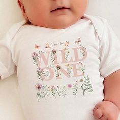 To order MULTIPLE SHIRTS, add to cart ONE at a time. Celebrate your little one's special day with our enchanting Wildflower Birthday Shirt Wildflower Family Shirts collection. For a Boho Girls Tee with a touch of whimsy, our Boho Girls Tee Wildflower and Boho Wildflower Birthday Family Shirts are perfect. Dress your little girl in a Boho Wild One Wildflower 1st Birthday Girl Shirts for Family or a Butterfly Wildflower Toddler T-shirt. The Cottagecore inspired collection includes the First Birthd Wild Flowers Party, Pink Onesie For Birthday In Spring, White Onesie For Summer Gift, White Onesie As Summer Gift, Summer Gift White Onesie, White Onesie For First Birthday On Mother's Day, Summer First Birthday Onesie With Name Print, Cute Personalized Onesie For Birthday, Personalized Birthday Onesie For Mother's Day