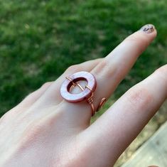 This ring is made to be adjustable! The two ends of the wire on the bottom bend apart to be adjusted!  The circle bead will not move and is glued down.  I love this unique ring and when I made it I knew It needed a unique name! A very good statement ring that could work well with some cute pink or copper rings or other jewelry. Be aware that copper can cause the skin to be green when wet. This is naturally occurring and is a chemical reaction called oxidation.  If you are allergic to certain met Adjustable Minimalist Wire Wrapped Rings, Minimalist Adjustable Wire Wrapped Rings, Adjustable Wire Wrapped Rings For Promise, Adjustable Wire Wrapped Promise Ring, Adjustable Circular Copper Jewelry, Adjustable Hand Wrapped Midi Rings, Adjustable Copper Metal Ring Jewelry, Adjustable Rose Gold Wire Wrapped Ring, Adjustable Wire Wrapped Rose Gold Ring