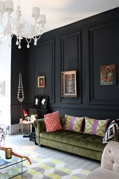 a living room filled with furniture and a chandelier