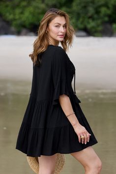 Turn heads at the beach with our Black Half Sleeve Tassel Tie Mini Cover-Up Dress! Featuring playful tassel ties and flattering half sleeves, this versatile piece effortlessly transitions from beachside chic to poolside glamour. Product code: DAA07B4B017AA Features:  Woven Plunging neckline Tassel tie Lace detail Mini Wash Method: Regular Wash Material: 60%RAYON,40%POLYESTER. Short Sleeve Drawstring Summer Dress, Beach Dress With Drawstring And Short Sleeves, Short Sleeve Drawstring Beach Dress, Short Sleeve Drawstring Vacation Dress, Half Sleeve Summer Vacation Dresses, Summer Vacation Dress With Half Sleeves, Summer Vacation Dresses With Half Sleeves, Black Beach Dress With 3/4 Sleeve, Black 3/4 Sleeve Beach Dress