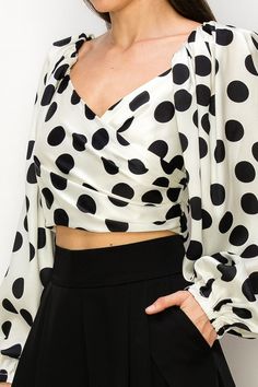 Long Puff Sleeve Polka Dot Crop Top Features a stylish polka dot pattern Designed with long puff sleeves for added flair Crop top length for a trendy look Back zipper closure for easy wear Material is not stretchy for a structured fit Runs small, consider sizing up for a comfortable fit Polka Dot Long Sleeve Tops For Party, Polka Dot Long Sleeve Party Tops, Polka Dot Long Sleeve Top For Night Out, Long Sleeve Polka Dot Top For Night Out, Spring Polka Dot Tops For Night Out, Polka Dot Tops For Spring Night Out, Trendy Polka Dot Top For Night Out, Chic Polka Dot Tops For Fall, Chic Polka Dot Tops For Night Out