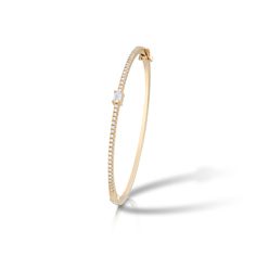 This beautiful bangle bracelet showcases 0.80 total carats of diamonds set in 14 karat yellow gold. Set in the center of the bangle is an emerald cut diamond accented by a line of round brilliant cut diamonds. The diamonds are G-H color and VS1-VS2 clarity, and the bracelet is hinged for easy wearability. Reference Code: 35584 Shop other beautiful pieces in our Bracelet Collection. For inquiries on the piece please contact: boutique@shsilver.com Diamond Bangles Bracelet, Diamond Bangle, Emerald Cut Diamonds, Bracelet Collection, Emerald Cut, Round Brilliant, Round Brilliant Cut Diamond, Brilliant Cut Diamond, Bangle Bracelets