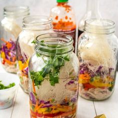 several jars filled with different types of food