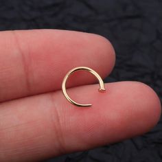 A small and thin nose ring half hoop in 14k solid gold, this tiny gold nose hoop has a flat stud stopper in the end, so it is comfortable for wearing, 14k solid gold nose ring is also available, thin nose ring hoop is perfect nose piercing jewelry. Minimalism and simple looking, so classic and dainty. Hoop Nose Ring, Faux Nose Ring, Thin Nose, Nose Ring Hoop, Gold Nose Hoop, Gold Nose Ring, Perfect Nose, Nose Piercing Jewelry, Gold Nose Rings