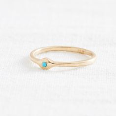 A little blip of color to brighten up your look. This charming little Sleeping Beauty Turquoise is set into a minimal 14k setting. Sleeping Beauty Turquoise is prized for it's even, consistent color and sky-blue hue, and this stone is no exception- the simplicity of the setting allows the bright stone to shine. Comfortable, unique, and feminine: what's not to love? Materials: 14k, 1.6mm Ethically Sourced Sleeping Beauty Turquoise Size: 7.75 ready to ship, can be resized. Allow up to 10 days for Turquoise Minimalist Jewelry For Anniversary, Stackable Blue Turquoise Ring In 14k Gold, Minimalist Turquoise Jewelry For Anniversary, Elegant 14k Gold Turquoise Birthstone Ring, Turquoise 14k Gold Jewelry With Bezel Setting, Blue Turquoise Ring In 14k Gold, Blue Turquoise 14k Gold Fine Jewelry Ring, Everyday Turquoise 14k Gold Jewelry, Everyday 14k Gold Turquoise Jewelry