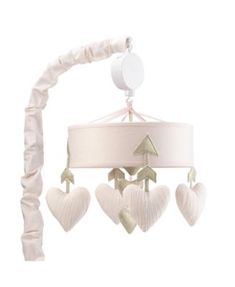 a baby crib mobile with hearts hanging from it's sides and a white lamp shade