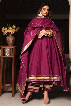 Be the paradigm of classic whenever you dress up in this cotton anarkali Suit Set. The combination of royalty and style is surely something that will make you look different from the crowd! beautiful and stylish this set comes with a jaal work cottonand dupatta that adds an extra charm! PRODUCT DESCRIPTION: Kurta & Pant: Cotton Dupatta: Pure Cotton Color: Burgundy No. Of Components : Set of 3 Embroidery Details: Lace Work Wash Care : Dry Clean Customization : Only Size and Length Of Product SKU# Purple Anarkali, Function Dresses, Cotton Anarkali, Simple Kurti Designs, Traditional Indian Dress, Indian Dresses Traditional, Traditional Indian Outfits