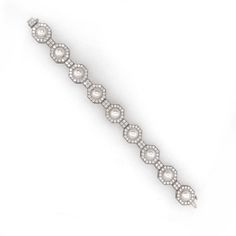 A classic and elegant platinum 950 bracelet adorned with white round fresh water pearls. Each pearl is placed within an octagonal frame adorned by round natural white diamonds 6.35 ct. Diamonds are white, natural and in G-H Color Clarity VS. The perfect mother's day gift. Length: 18.5 cm Width: 1.4 cm Weight: 258 g Diamond Cuff Bracelet, Platinum Bracelet, 18k Gold Jewelry, White Gold Bracelet, Fresh Water Pearls, Water Pearls, Pearl Diamond, White Diamonds, Mother's Day Gift