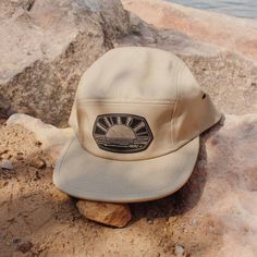 Welcoming the third and final addition to our Summer Adventure Series...The Sun Seeker! Because who doesn't want to seek more sunshine?!? Complete with warm tones and fun line work, this is the go-to accessory you need for all your sunny adventures! Choose from a black or khaki low profile 5 panel hat with our black & gold, laser engraved faux leather patches! Or if you're needing a bit more color in your life, take a look at our nylon pinch-front rope hat in mustard yellow! Adjustable Sun Hat For Outdoor Activities, Summer Outdoor Snapback Trucker Hat, Summer Trucker Hat With Curved Brim For Outdoor, Summer Trucker Hat For Outdoor, Summer Outdoor Baseball Cap With Uv Protection, Summer Baseball Cap With Uv Protection For Outdoor, Summer Baseball Cap For Outdoor, One Size Fits Most, Summer Baseball Cap, One Size Fits Most For Outdoor, Casual Uv Protection Hat For Camping