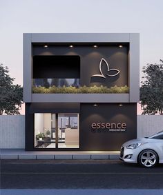 a car parked in front of a building with a sign that says essence on it