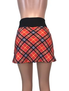 Step up your game in this fun and colorful athletic skirt with built in compression shorts and pocket. This golf, tennis, running or sports skirt is slim-style, but allows for plenty of movement, made of a red plaid high quality performance spandex. The compression shorts are uniquely designed to be incredibly comfortable and won't ride up during activity. The pocket is positioned on the side of the shorts, and will fit your phone, keys, ID, etc. *Please see size chart in images above for standa Fitted Tennis Skort With Lined Skirt, Stretch Lined Mini Skirt For Tennis, Casual Fitted Swim Skirt For Sports, Fitted Mini Skort For Tennis, Casual Lined Swim Skirt With Short Inseam, Fitted Tennis Skort With Elastic Waistband, Fitted Tennis Skort, Fitted Lined Swim Skirt For Sports, Casual Fitted Swim Skirt With Elastic Waistband