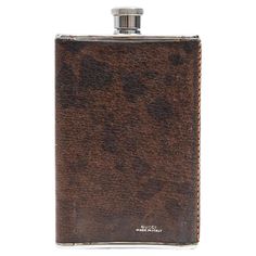 a flask with a brown pattern on it