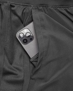 a close up of a cell phone in the pocket of a sports pants with pockets