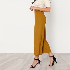 These wide leg pants are absolutely perfect. Featuring an elastic waist, flare legs falling mid-calf, and a ribbed finish. These pants pair perfectly with a blazer, bodysuit and pumps for an Office Chic look or pair with a bodysuit, heels and statement jewelry for a night on the town. Made with a polyester and spandex blend for comfort and style. Office Chic, Chic Office, Professional Outfits, Ankle Pants, Statement Jewelry, Mid Calf, Leg Pants, Wide Leg Pants, Harem Pants