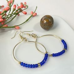 Beaded 14k Gold Filled Hoop Earrings, Adjustable Gold Hoop Earrings With Faceted Beads, Blue Wire Wrapped Hoop Beaded Earrings, Blue Beaded 14k Gold-filled Jewelry, Gold Round Beaded Earrings With Faceted Beads, Gold Round Faceted Beads Earrings, Handmade Blue 14k Gold Filled Hoop Earrings, Handmade Blue Hoop Earrings In 14k Gold Filled, Blue Beaded Jewelry In 14k Gold Filled