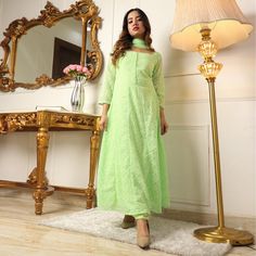 Pista Green colored suit is prettified with chikankari and gota work as shown which makes it appear classy. This top is made of georgette fabric which is accompanied with georgette bottom, crepe lining and georgette dupatta. Women can buy this suit to wear for their parties and functions. Note:- The actual product may differ slightly in color and design from the one illustrated in the images when compared with computer or mobile screen. Size Chart Size: Semi Stitched/Unstitched can be altered fr Fitted Green Anarkali Set With Chikankari Embroidery, Anarkali Salwar Kameez In Pista Green With Chikankari Embroidery, Anarkali Pista Green Chikankari Salwar Kameez, Anarkali Lawn Suit With Chikankari Embroidery For Party, Festive Green Kurta With Lace Work, Designer Green Lace Sets, Festive Lawn Suit With Lace Work For Party, Anarkali Pista Green Set With Chikankari Embroidery, Fitted Green Salwar Kameez With Chikankari Embroidery