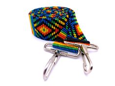 "These 48\" long multi-purpose beaded straps are a stunner! It's vibrant colors and brilliant glass beads make it unique and make it POP. Handmade with impeccable precision and detail, the straps can be re-purposed as a crossbody/purse strap, luggage strap, guitar bag strap, and even as a crossbody for your camera bag. With strong Native influences, these multi-functional straps are designed to make you feel bold and empowered! Length: 48\" Width: 1.25\" Handmade in Guatemala *Please note that a Multicolor Crossbody Shoulder Strap For Everyday Use, Travel Multicolor Beaded Shoulder Bag, Guitar Strap Bag, Guitar Bag, Luggage Strap, Chic Bracelet, Handmade Wallets, Phone Lanyard, Luggage Straps