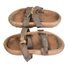 Antique Asian Primitive Wood Clog Shoes Double Leather Strap Open Toe Sandals with Cleats 19th Century Japan Pair of  Antique Wood  Iron & Leather Primitive Garden Sandals Shoes Clogs with Cleats -metal spikes on sole. Splendid character in Original antique unrestored unaltered Preowned condition.  Unsigned. No information on the maker.  Dimensions: 11.5 L x 5 W x 2.25 tall (each) inches Original vintage unrestored condition. Patina present. The leather is worn. Perfect decorative item. Refe Gardening Shoes, Medieval Garb, Beautiful Character, Metal Spikes, Decorative Wood, Metal Tree, Antique Wood, Asian Antiques, The Maker